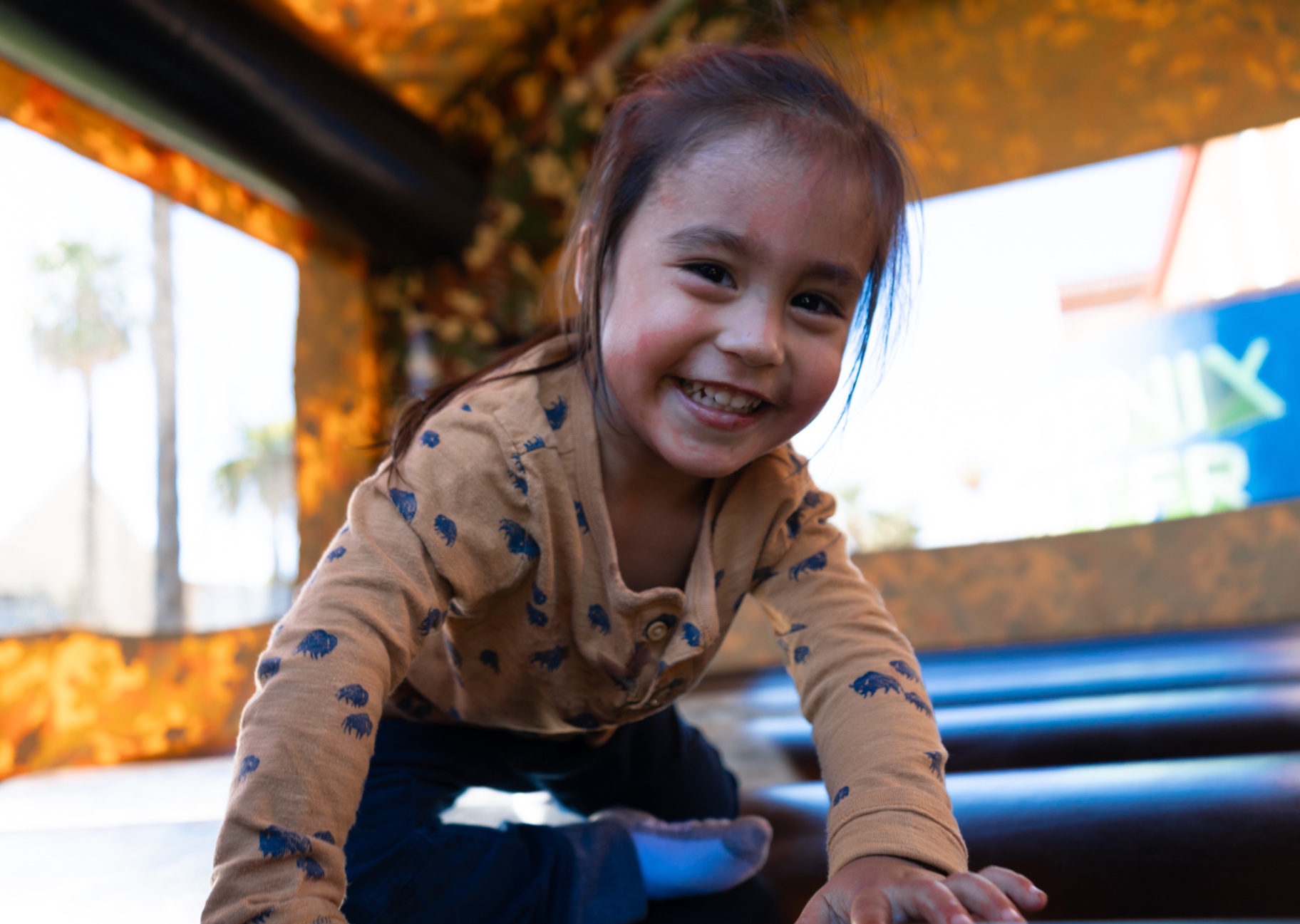 A child laughing during an event activity